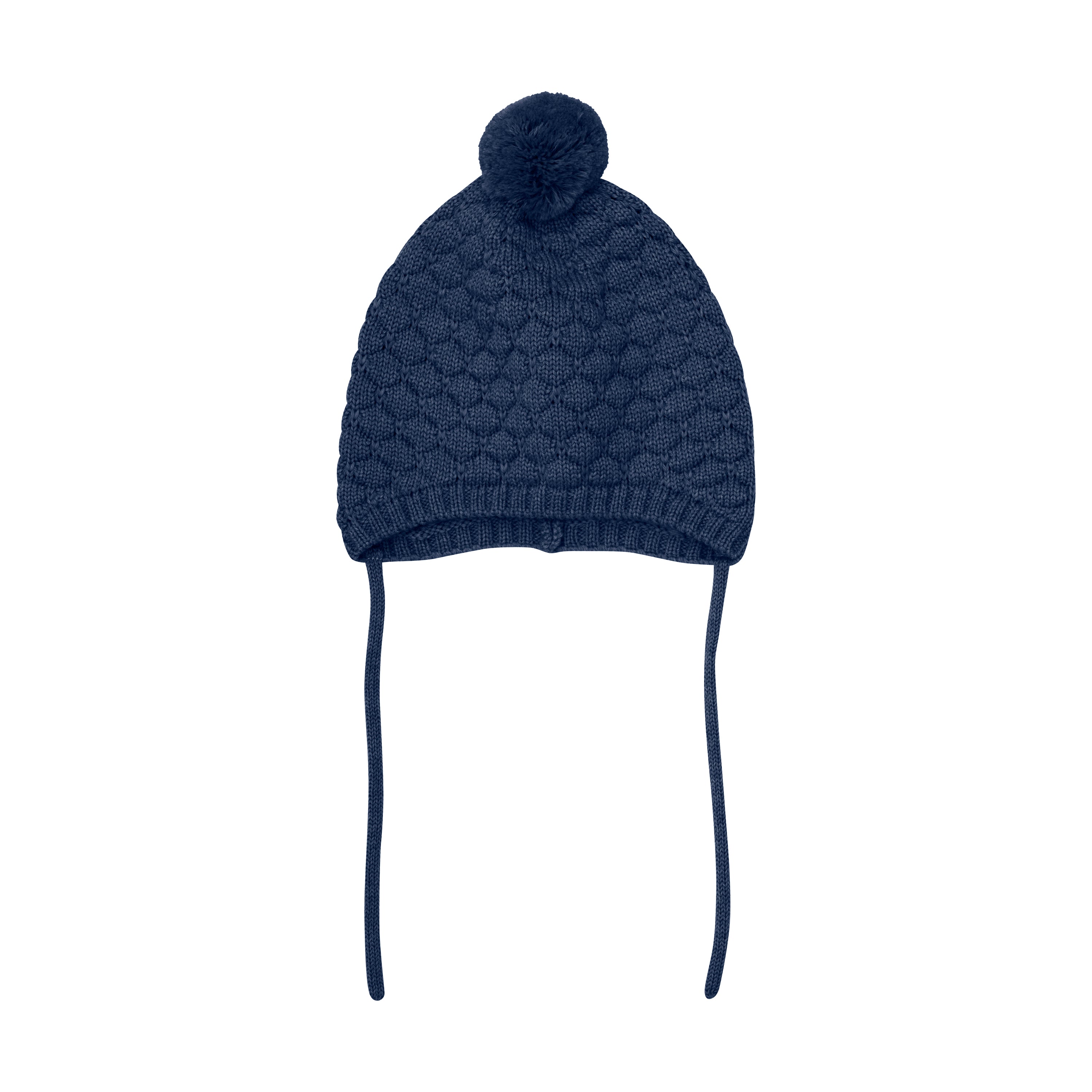 Baby iført Huttelihut hue i Overture – varm og blød strikket hue i merinould.